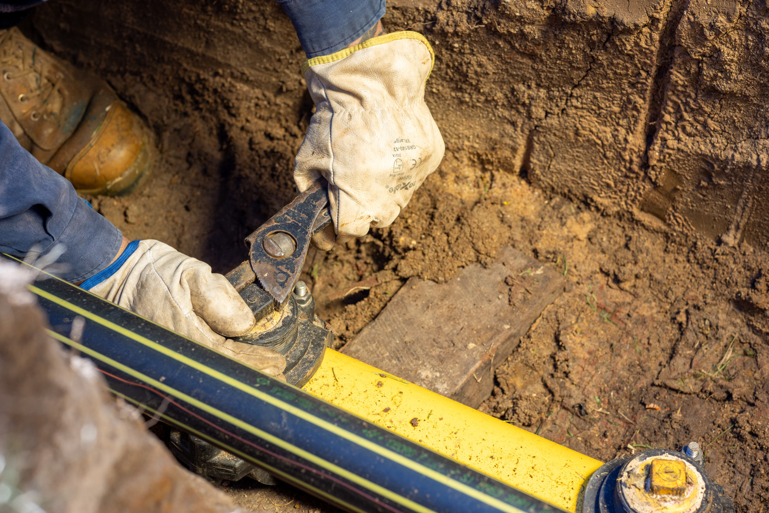 A gas pipe being screwed closed